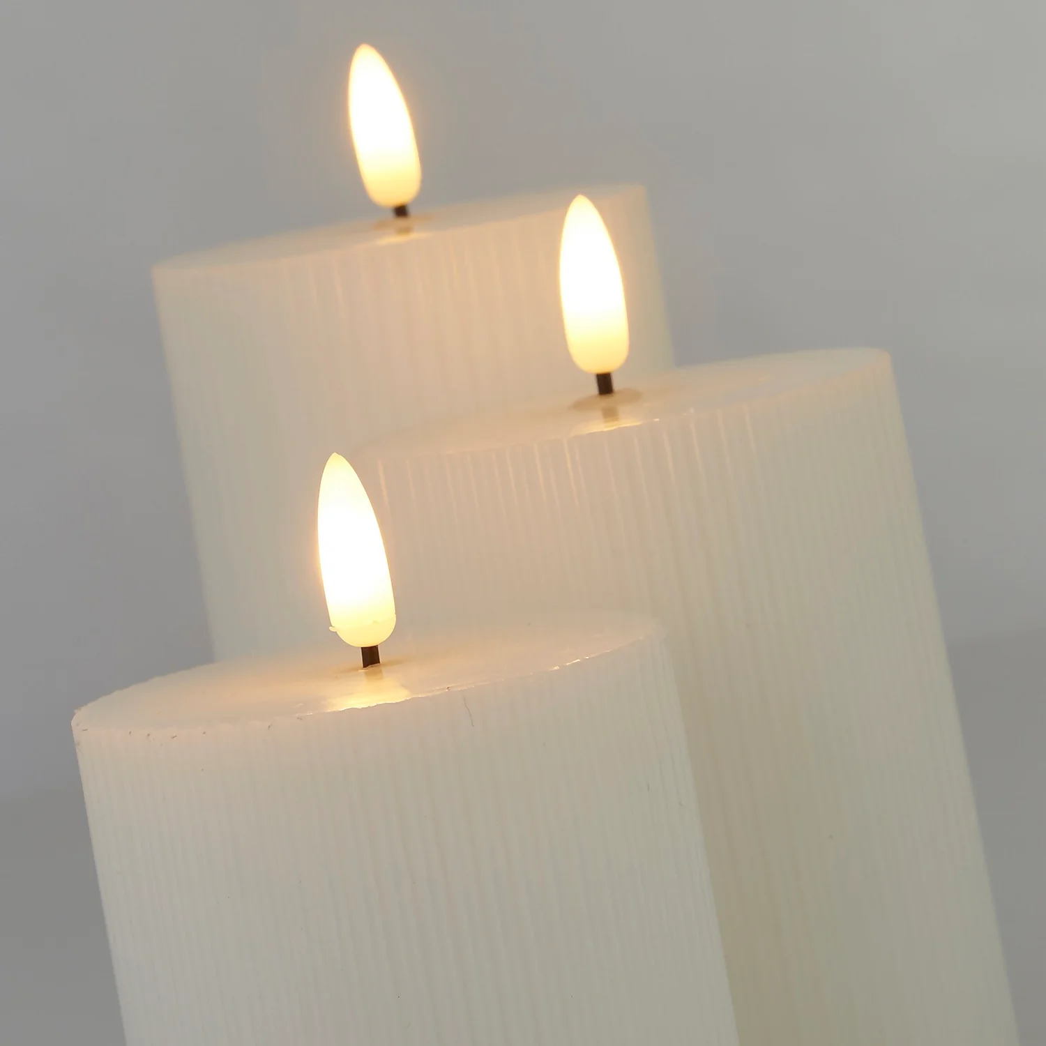 Pack Of 3 LED Pillar Ribbed Candles - White 4 Pack Of 3 LED Pillar Ribbed Candles - White - Image 4